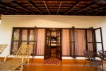 Veranda of Royal Luxury Cottage with cane easy chairs