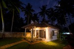 Luxury cottage beautifully lit in the night